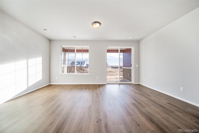 22384 E 49th Pl, Aurora, CO 80019 - spare room with wood finished floors and baseboards