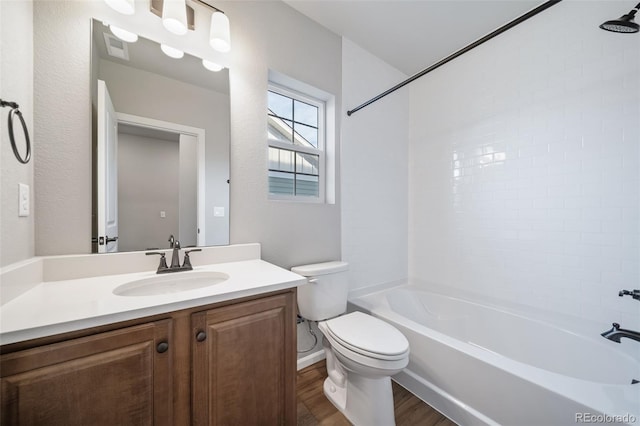 22384 E 49th Pl, Aurora, CO 80019 - bathroom featuring wood finished floors, vanity, and shower / tub combination