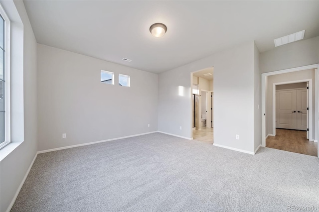 22384 E 49th Pl, Aurora, CO 80019 - carpeted spare room featuring baseboards