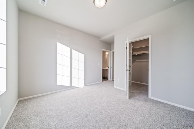 22384 E 49th Pl, Aurora, CO 80019 - unfurnished bedroom with carpet floors and a walk in closet