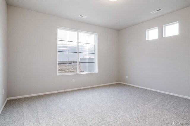 22384 E 49th Pl, Aurora, CO 80019 - spare room featuring carpet and baseboards