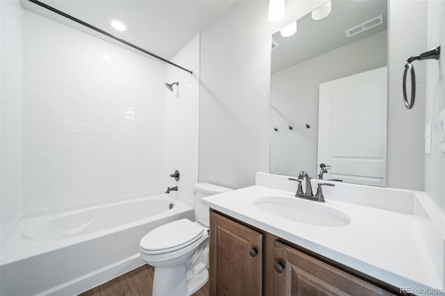 22384 E 49th Pl, Aurora, CO 80019 - bathroom with wood finished floors, shower / washtub combination, and vanity