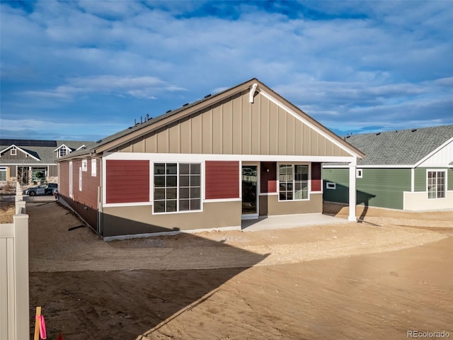 22384 E 49th Pl, Aurora, CO 80019 - rear view of property featuring a patio area and board and batten siding
