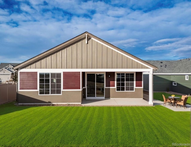 22384 E 49th Pl, Aurora, CO 80019 - back of property featuring a patio area and board and batten siding