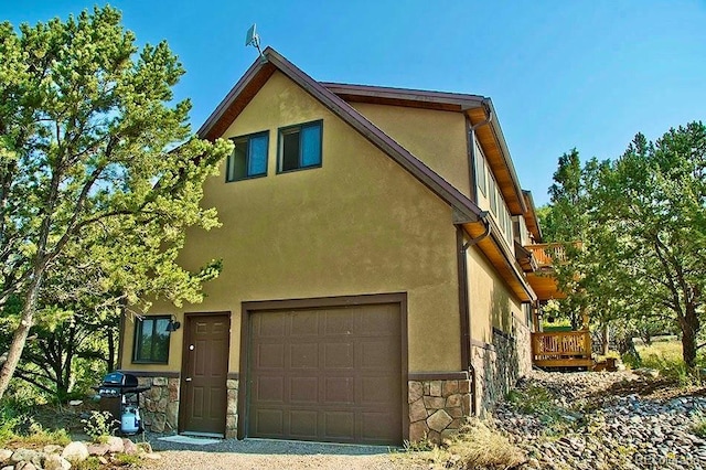 view of property exterior featuring a garage