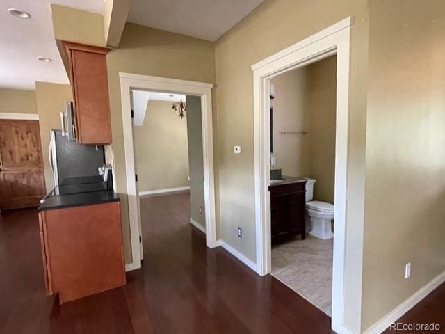 kitchen featuring dark hardwood / wood-style floors and fridge