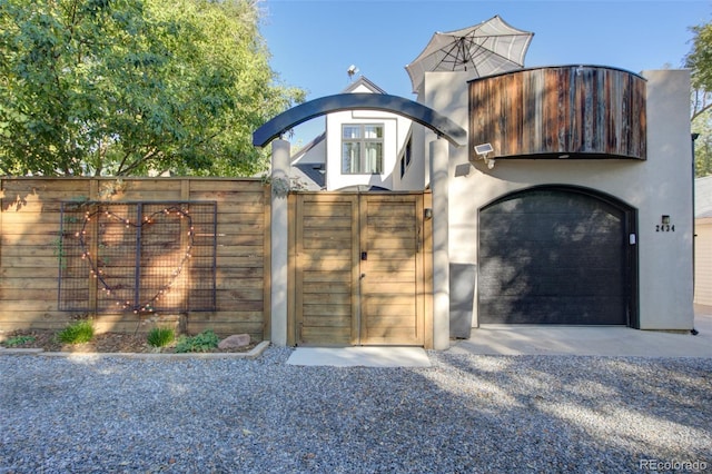 view of gate featuring a garage