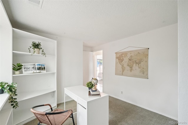 2393 E 90th Ave, Thornton, CO 80229 - office space featuring a textured ceiling, light carpet, and baseboards