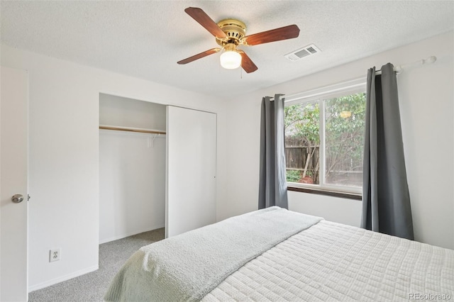 2393 E 90th Ave, Thornton, CO 80229 - carpeted bedroom with baseboards, a closet, a textured ceiling, and a ceiling fan