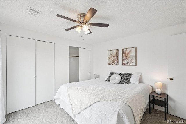 2393 E 90th Ave, Thornton, CO 80229 - carpeted bedroom with two closets, ceiling fan, and a textured ceiling