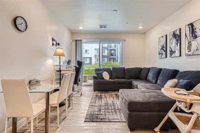 16841 Askins Loop Unit 105, Parker, CO 80134 - living room with hardwood / wood-style floors