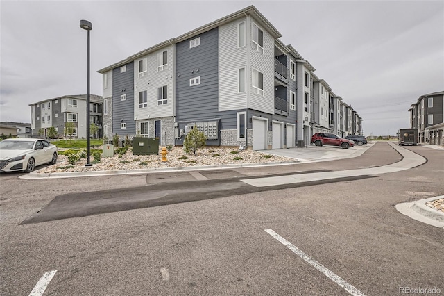 16841 Askins Loop Unit 105, Parker, CO 80134 - view of building exterior featuring a garage