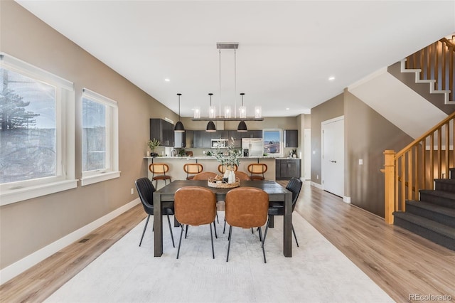 dining area with light hardwood / wood-style floors