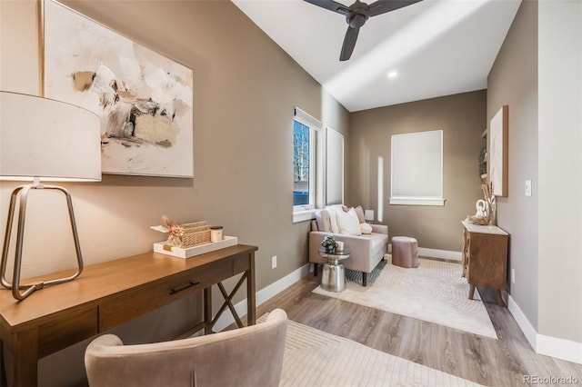 living area featuring ceiling fan and light wood-type flooring