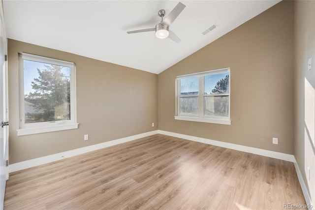 spare room with light wood-type flooring, ceiling fan, and lofted ceiling