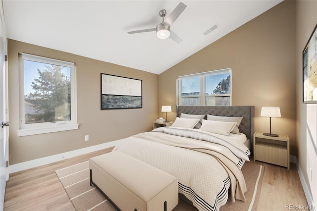 bedroom featuring ceiling fan, vaulted ceiling, and light wood-type flooring