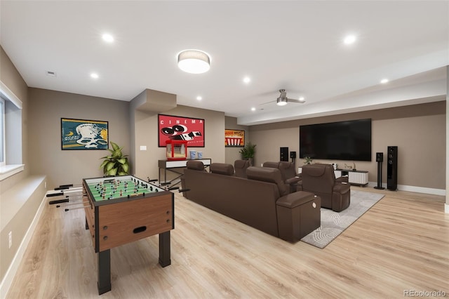 playroom with light hardwood / wood-style floors and ceiling fan