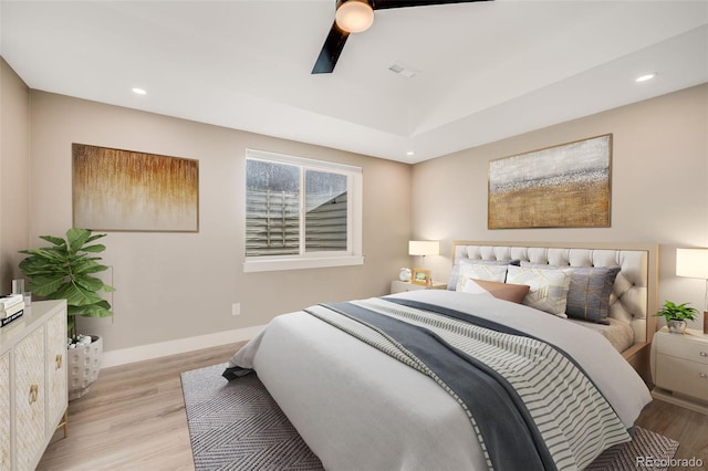 bedroom with light wood-type flooring and ceiling fan