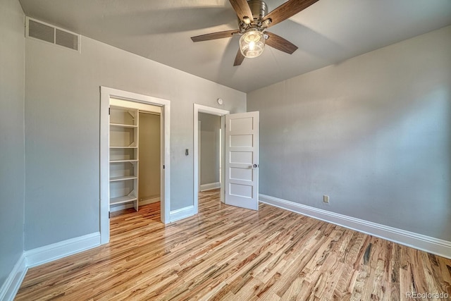 144 N C St, Salida, CO 81201 - unfurnished bedroom featuring light wood finished floors, baseboards, a closet, and ceiling fan