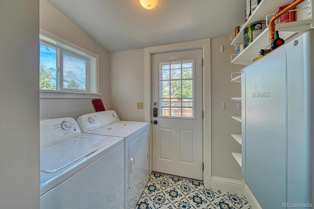 144 N C St, Salida, CO 81201 - laundry area featuring washer and dryer, baseboards, and light tile patterned flooring