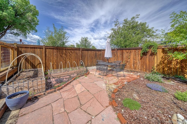 144 N C St, Salida, CO 81201 - fenced backyard with a patio and outdoor dining space