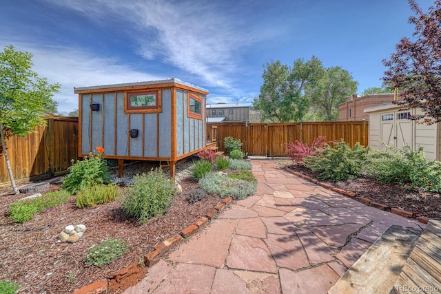144 N C St, Salida, CO 81201 - view of shed featuring a fenced backyard