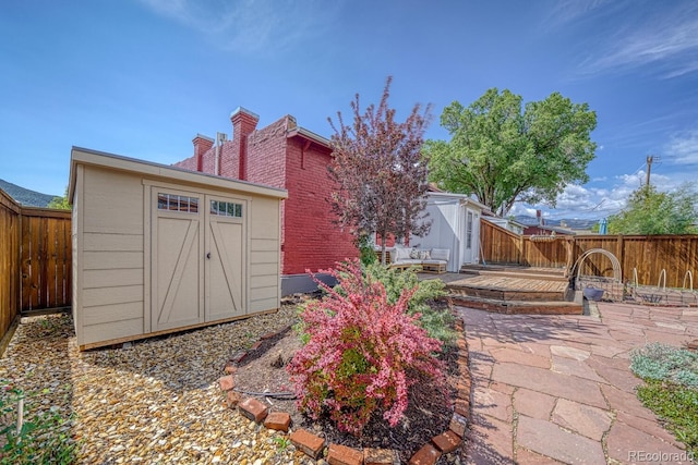 144 N C St, Salida, CO 81201 - fenced backyard with a wooden deck and a patio