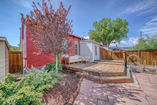 144 N C St, Salida, CO 81201 - fenced backyard with a wooden deck and outdoor lounge area