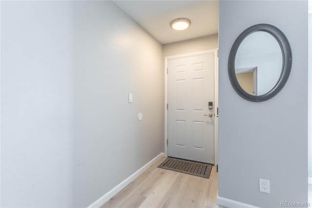 doorway to outside with light wood-type flooring