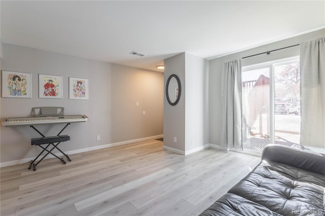 living room with light hardwood / wood-style flooring