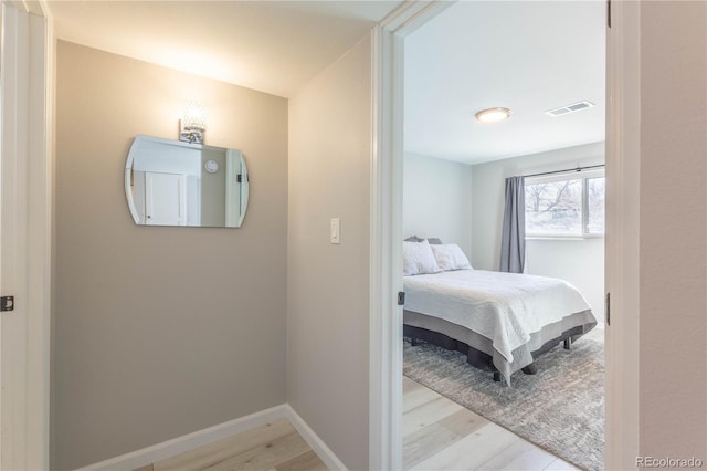 bedroom with light hardwood / wood-style flooring