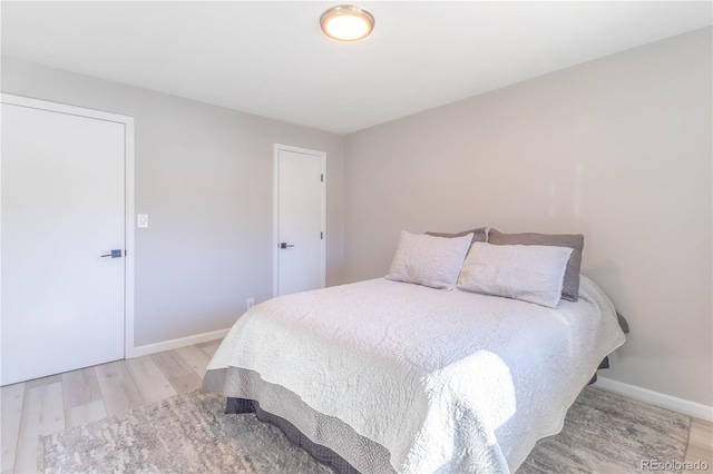 bedroom with light hardwood / wood-style floors