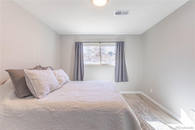 bedroom featuring hardwood / wood-style floors