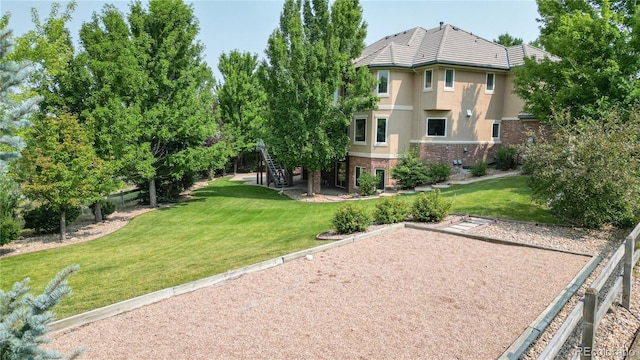 view of home's community featuring a lawn