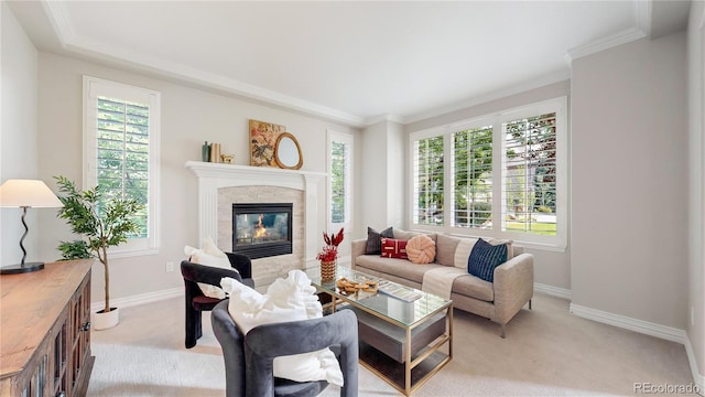 living room featuring crown molding, light colored carpet, and a fireplace