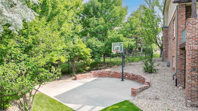 view of patio with basketball hoop