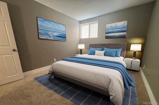 carpeted bedroom featuring baseboards