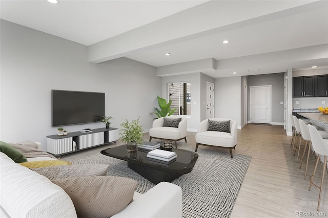 living area featuring light wood-type flooring, baseboards, beam ceiling, and recessed lighting