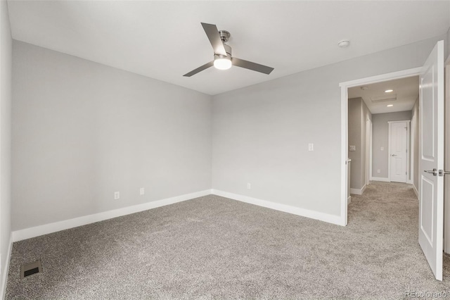 spare room with recessed lighting, visible vents, a ceiling fan, light carpet, and baseboards