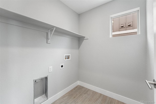 laundry area with washer hookup, light wood finished floors, hookup for an electric dryer, laundry area, and baseboards