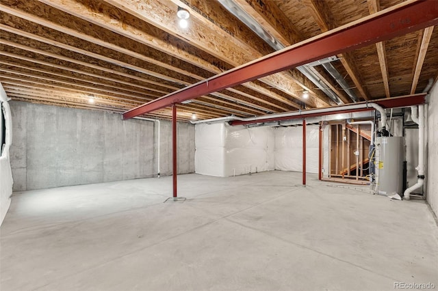 unfinished basement featuring water heater