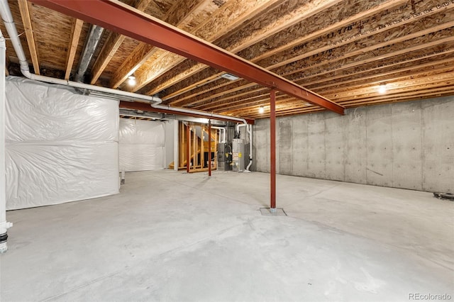 unfinished basement with gas water heater