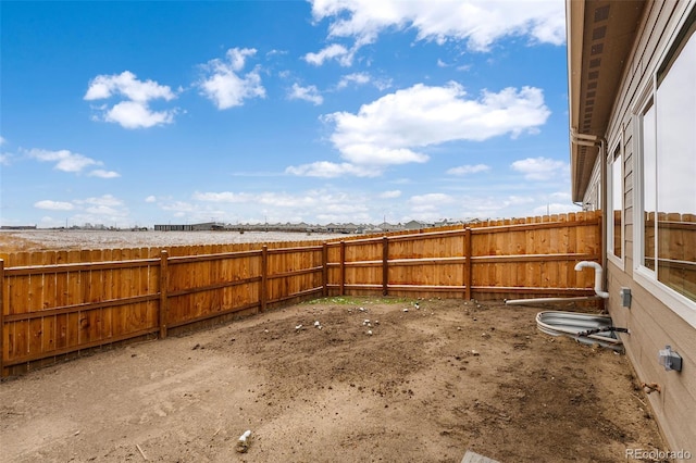 view of yard with a fenced backyard