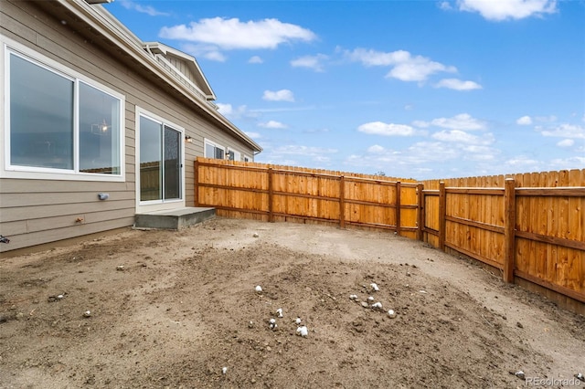 view of yard with a fenced backyard