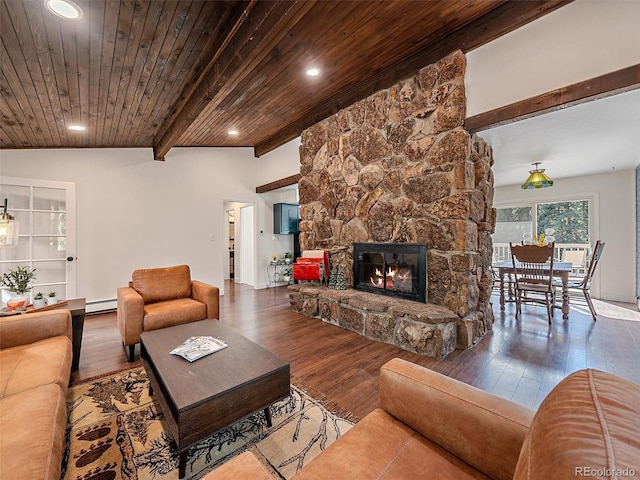 living area featuring wood finished floors, beam ceiling, a stone fireplace, wood ceiling, and a baseboard heating unit