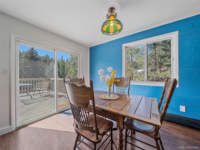 dining area with wood finished floors