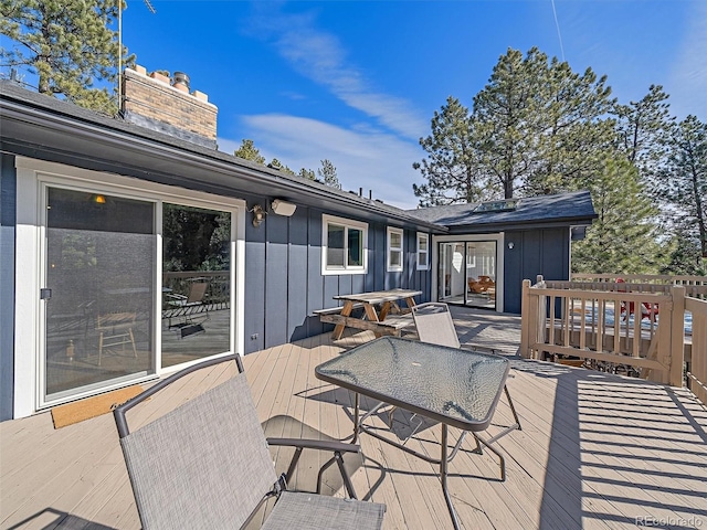 deck with outdoor dining space