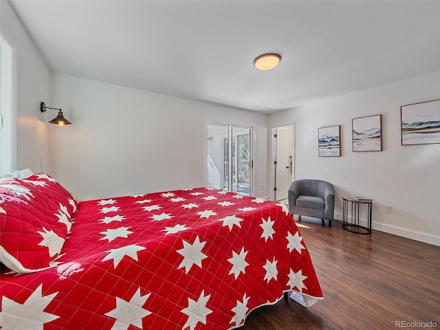 bedroom with baseboards, wood finished floors, and access to exterior