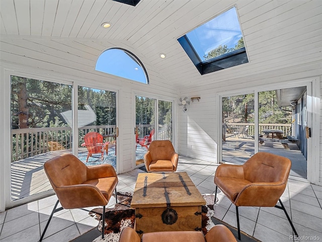 sunroom / solarium with lofted ceiling with skylight and wooden ceiling