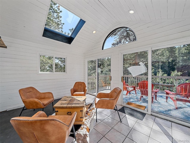 sunroom with lofted ceiling with skylight and wood ceiling